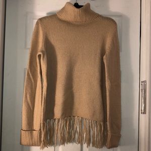 Fringed fuzzy tan turtleneck sweater